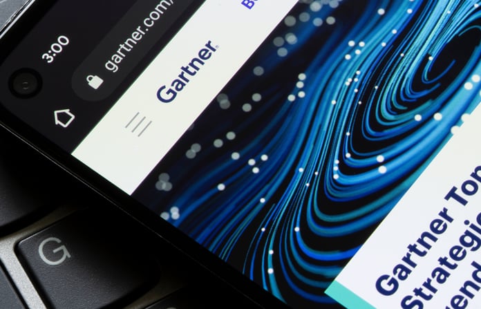 Big Changes in the Gartner 2023 Magic Quadrant for Contact Center as a Service Website homepage of Gartner, Inc seen on a mobile phone display.