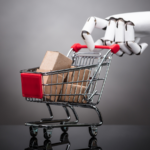 Robot holding mini shopping cart with cardboard boxes.