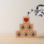 Robot hand on top of stacked tiles with marketing icons.
