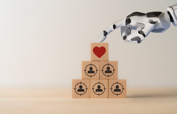 AI Personalization Marketing: The Future of Customized Advertising Robot hand on top of stacked tiles with marketing icons.