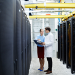 IT professionals on a data center hallway.