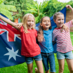 Australian kids holding the flag for Australia.