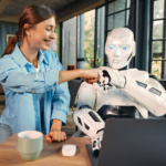 Woman and robot using a laptop bumping fists.