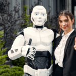 A humanoid robot and a woman making a thumbs up sign.