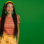 Young lady posing on green background.