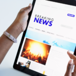 Woman reading news on a tablet.