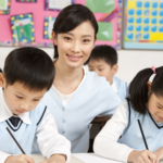 Teacher assisting students in class.
