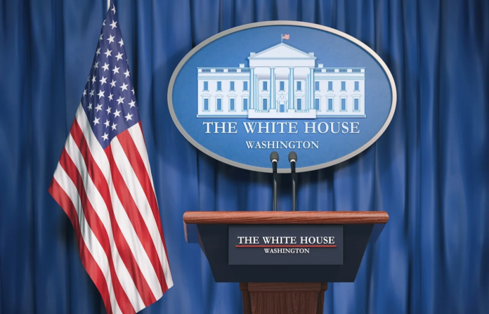 White House speaker podium with the US flag and logo on the background.