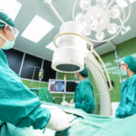 Doctors and medical professionals in an operating room.