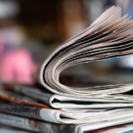 Newspaper on a table.