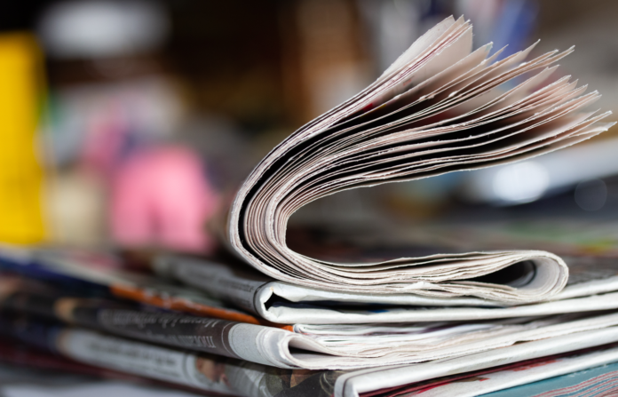 Newspaper on a table.