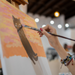 Watercolor artist is painting art on paper.