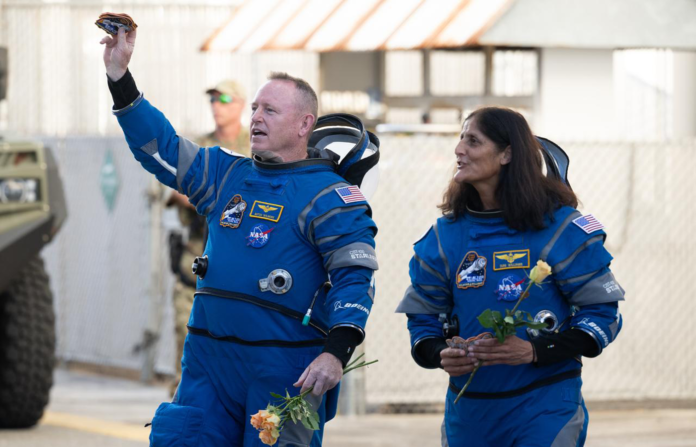 NASA astronauts Butch Wilmore, left, and Suni Williams prepare to depart the Neil A. Armstrong Operations and Checkout Building for Launch Complex 41 on Cape Canaveral Space Force Station to board the Boeing CST-100 Starliner spacecraft for the Crew Flight Test launch,.