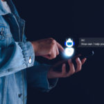 A man using his phone as an AI prompt greets him.