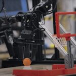 Google Gemini 2.0 robot playing basketball.