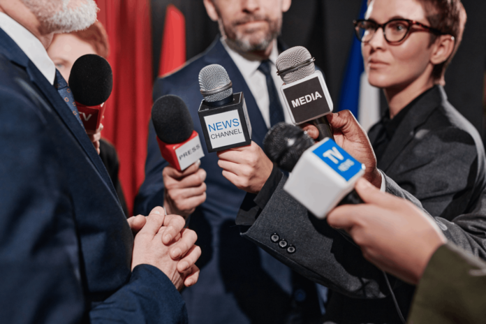 Journalist interviewing Businessman
