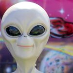 Stock image of a smiling alien.