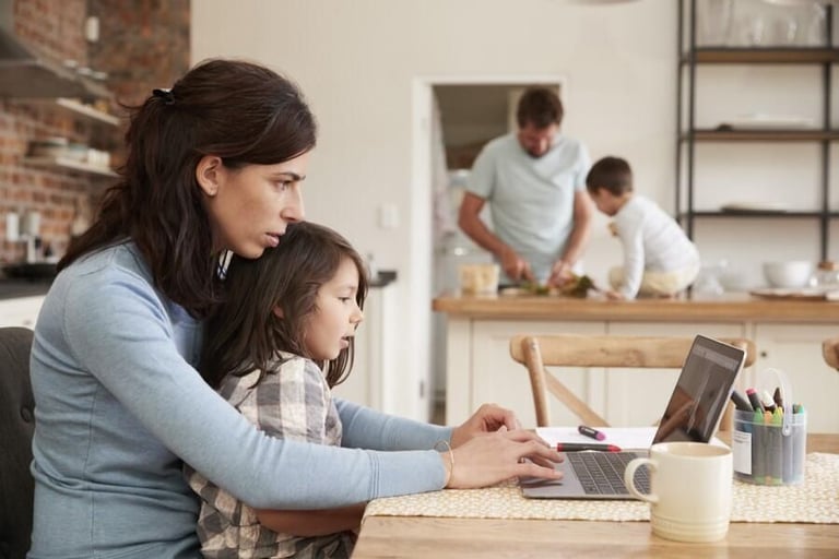 Stock photo of two parents and two kids at home.